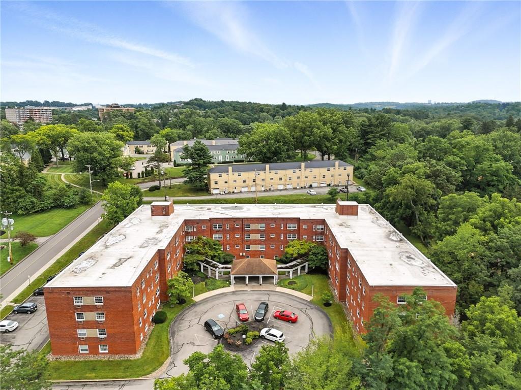 an aerial view of a house with a garden