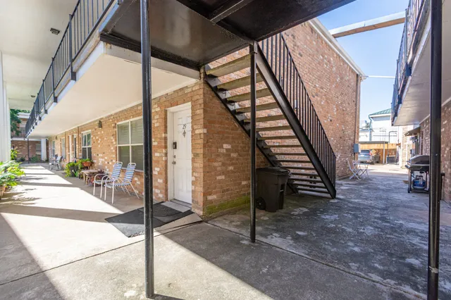 a view of a living room with stairs