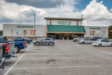a view of parking space with cars parked