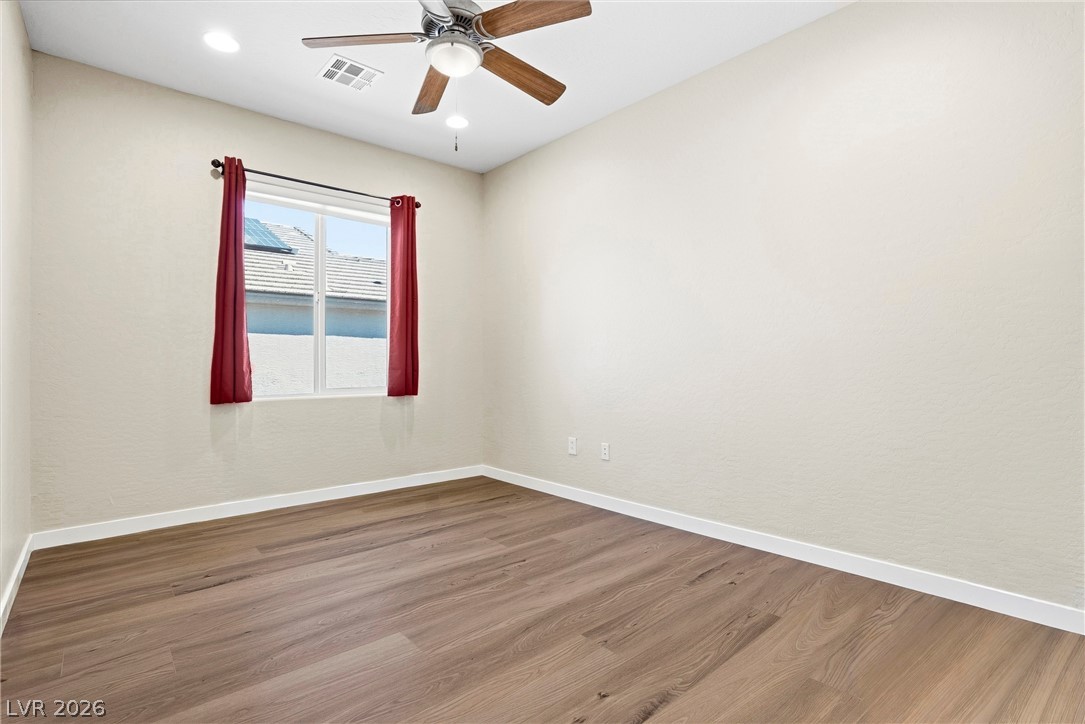 2541 Darda Street Henderson, NV 89044 - Photo 12 of 26 This bright room features a ceiling fan, recessed lighting, and durable wood flooring.