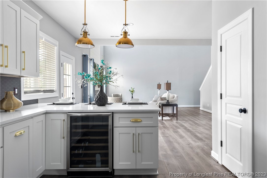 100 Sears Drive Cameron, NC 28326 - Photo 14 of 27 a kitchen with a sink cabinets and wooden floor
