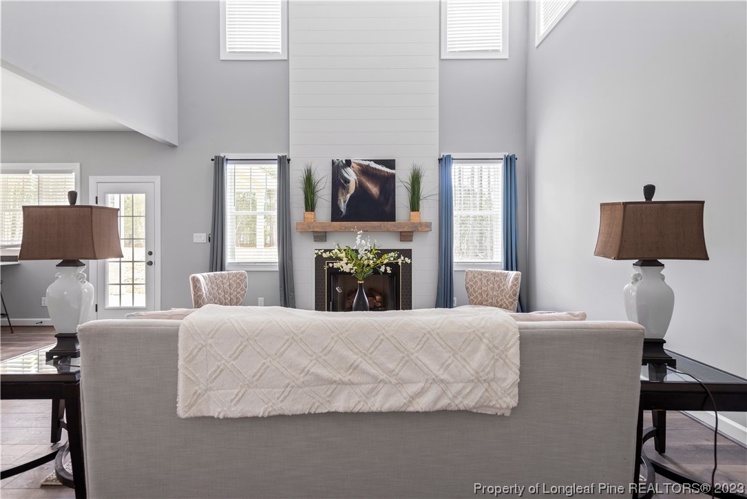 100 Sears Drive Cameron, NC 28326 - Photo 19 of 27 a bedroom with a bed and a lamp on table