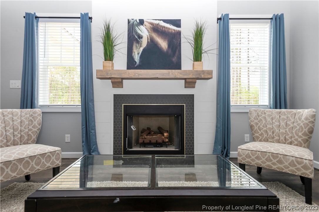 100 Sears Drive Cameron, NC 28326 - Photo 20 of 27 a living room with furniture and a fireplace