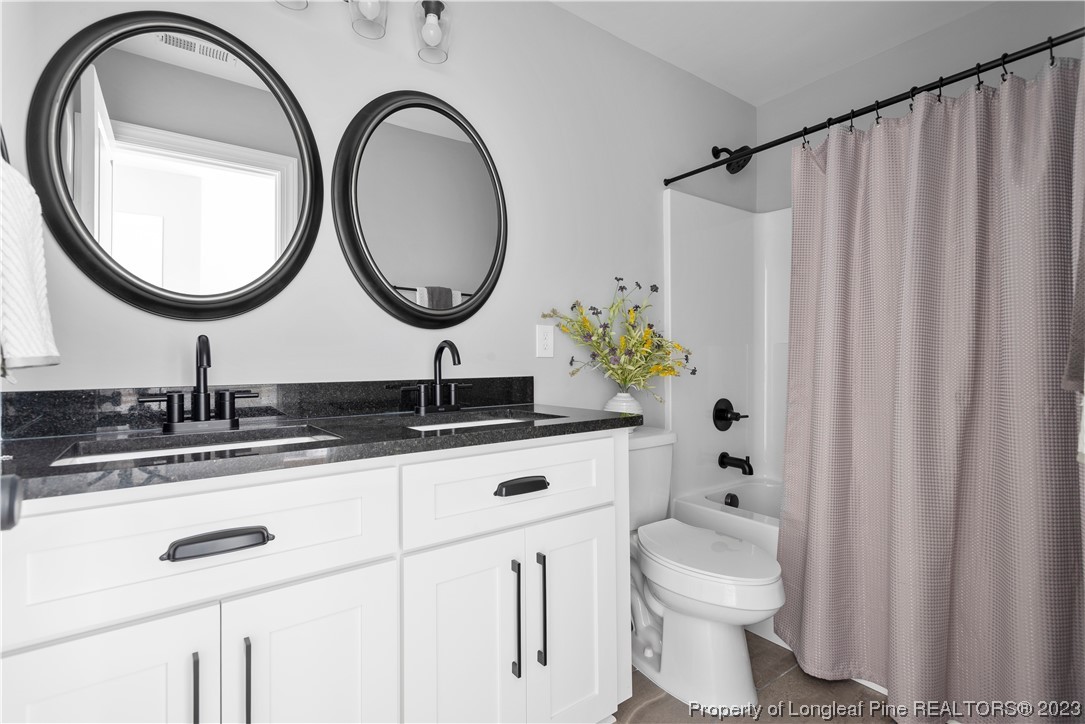 100 Sears Drive Cameron, NC 28326 - Photo 22 of 27 a bathroom with a sink and a mirror