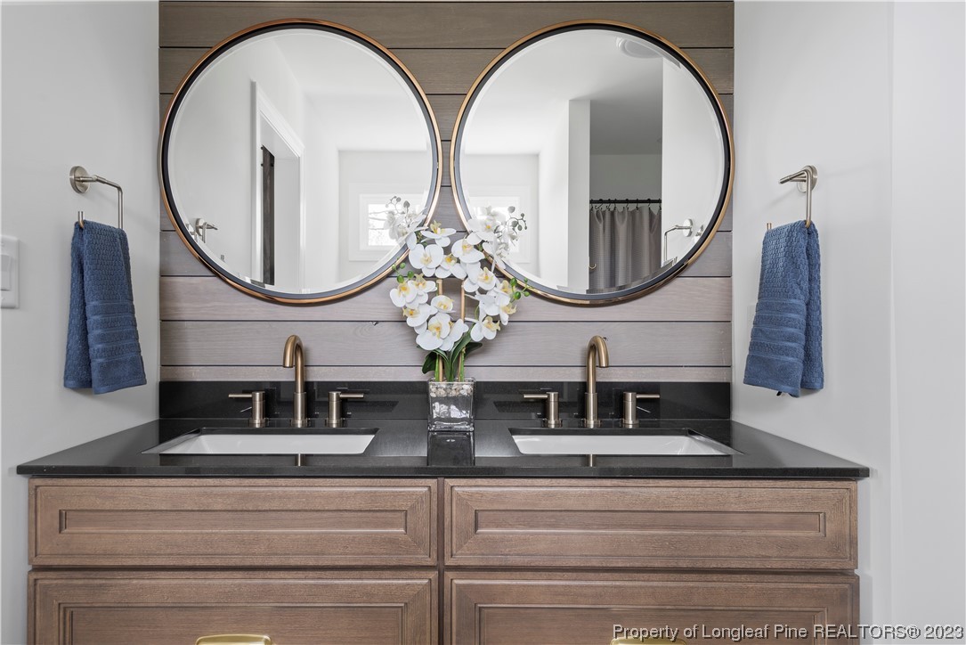 100 Sears Drive Cameron, NC 28326 - Photo 23 of 27 a front view of a house with large windows