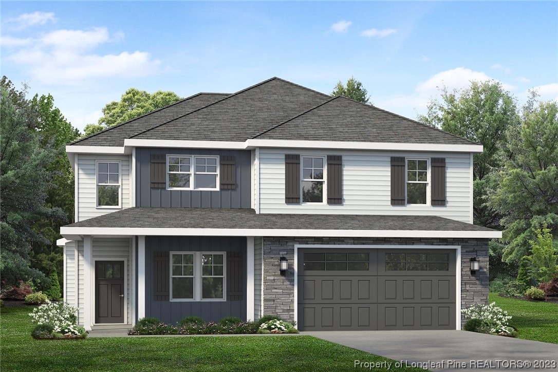 100 Sears Drive Cameron, NC 28326 - Photo 25 of 27 a front view of a house with a garden and yard