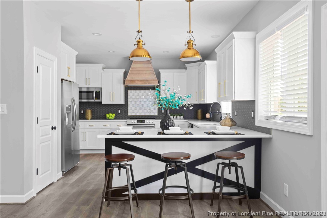 100 Sears Drive Cameron, NC 28326 - Photo 9 of 27 a view of a dining room with furniture and window