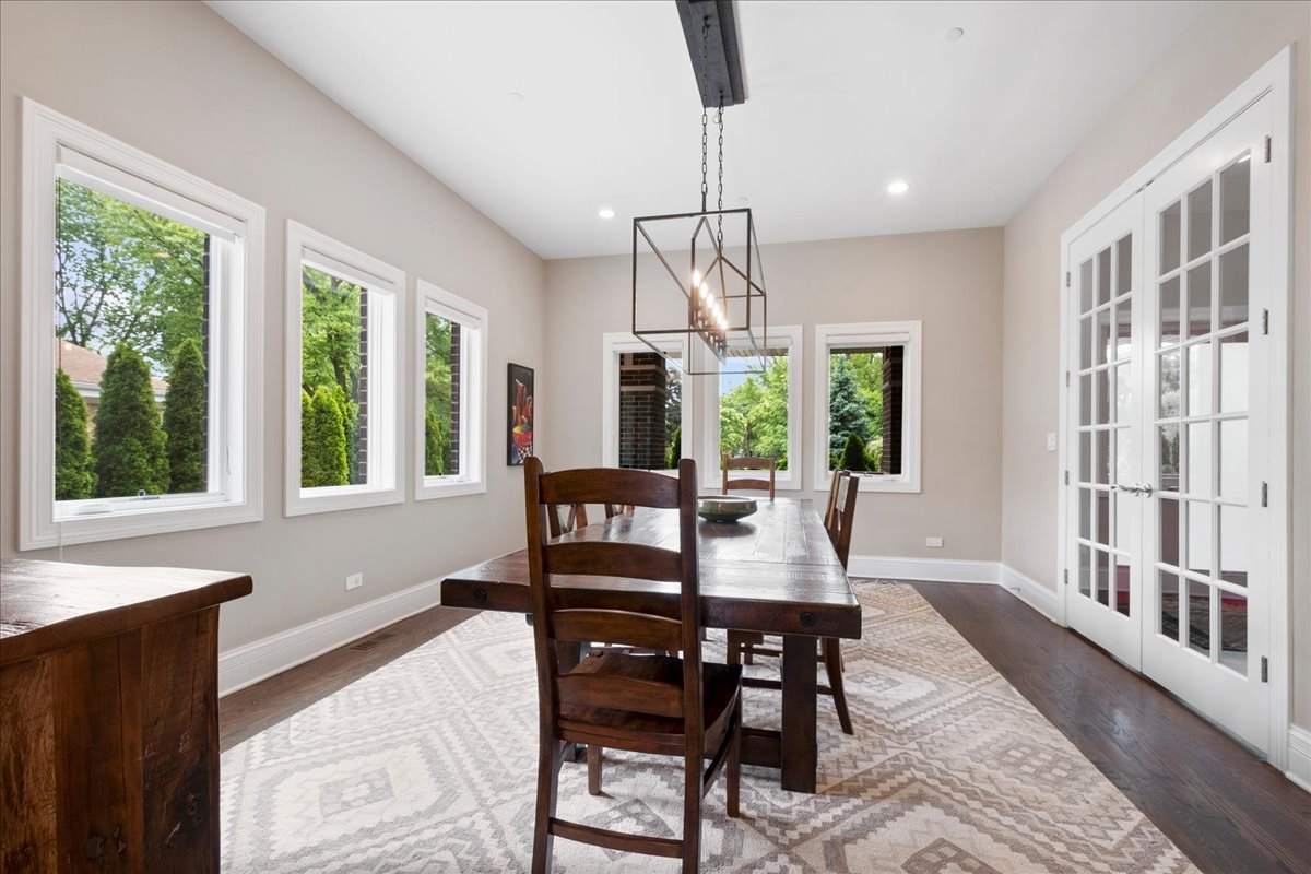 2921 Simpson Street Evanston, IL 60201 - Photo 5 of 41 a view of a dining room with furniture window and wooden floor