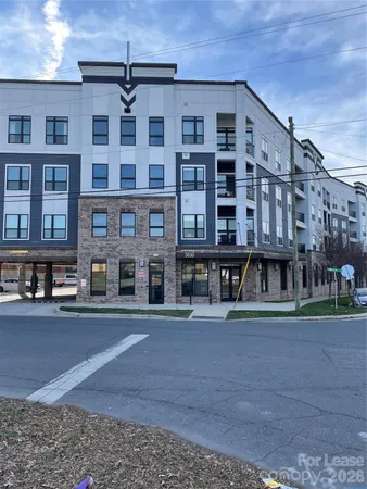 a front view of a building with lot of windows