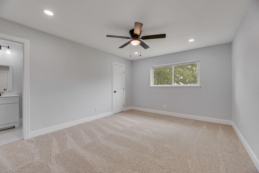 2015 Rose Hill Road Carrollton, TX 75007 - Photo 15 of 19 an empty room with a window and a fan