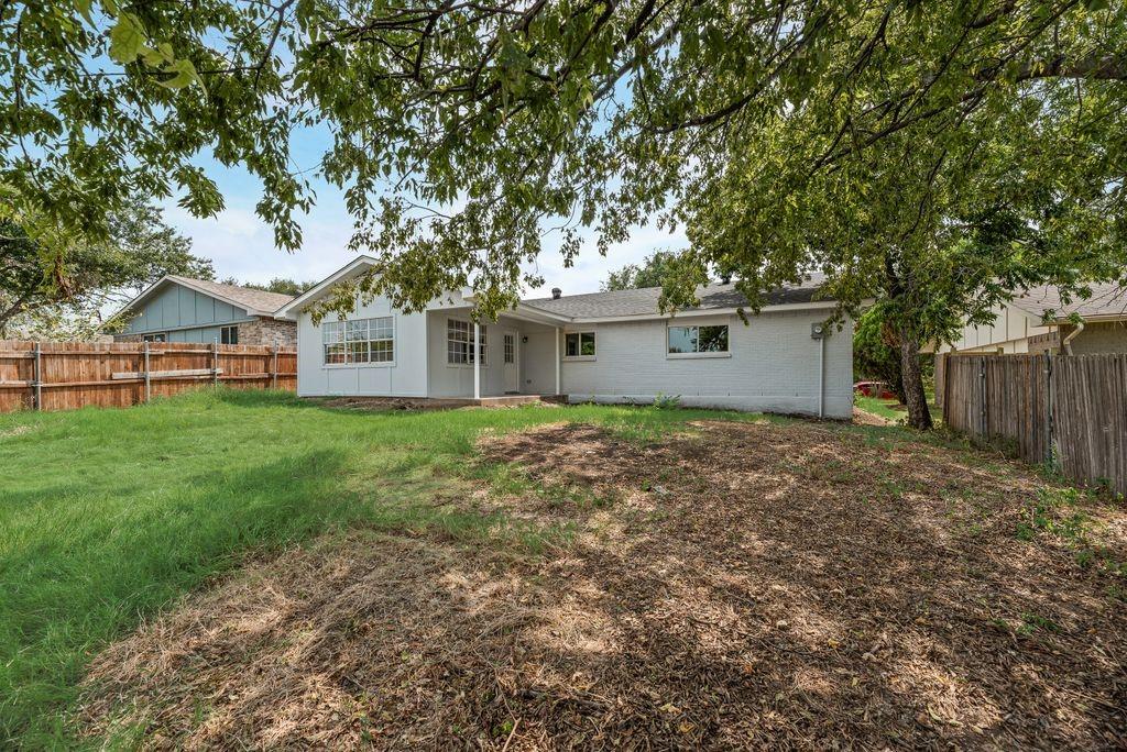 2015 Rose Hill Road Carrollton, TX 75007 - Photo 19 of 19 a front view of house with yard and green space