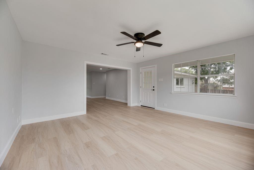 2015 Rose Hill Road Carrollton, TX 75007 - Photo 9 of 19 a view of empty room with window and ceiling fan