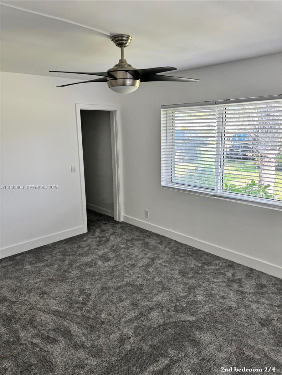 607 Maple Drive Margate, FL 33063 - Photo 17 of 37 an empty room with a window