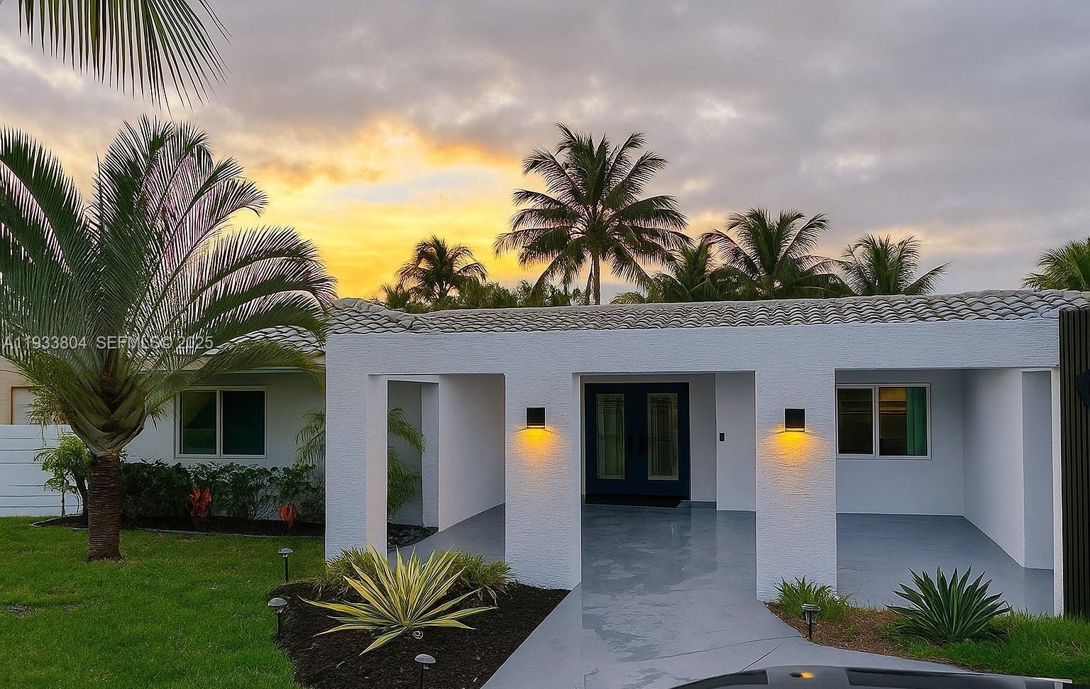 607 Maple Drive Margate, FL 33063 - Photo 2 of 37 a front view of house with yard and green space