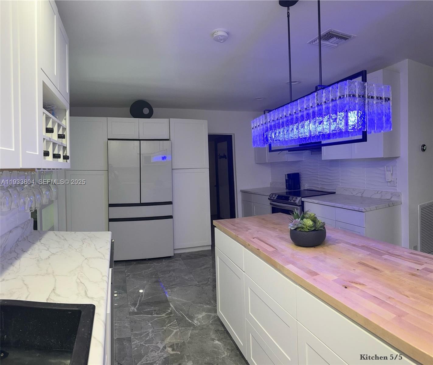 607 Maple Drive Margate, FL 33063 - Photo 28 of 37 a kitchen with a refrigerator a sink and dishwasher