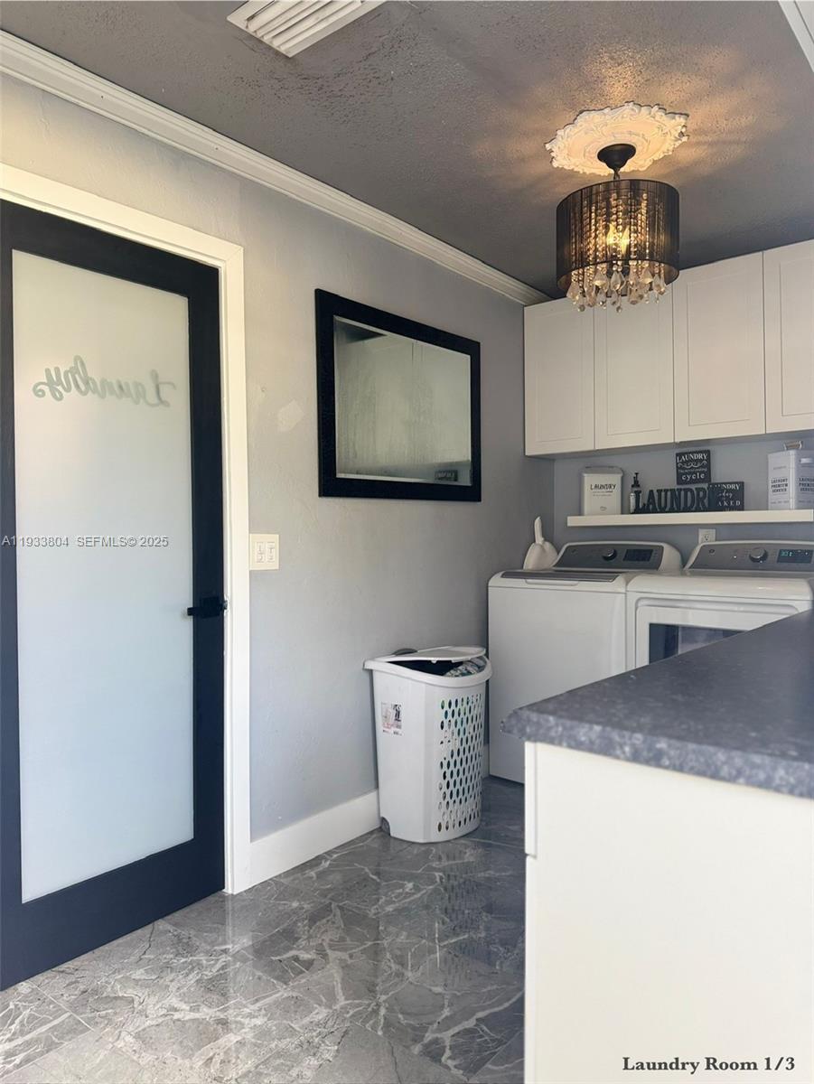 607 Maple Drive Margate, FL 33063 - Photo 29 of 37 a kitchen with a sink a stove and cabinets