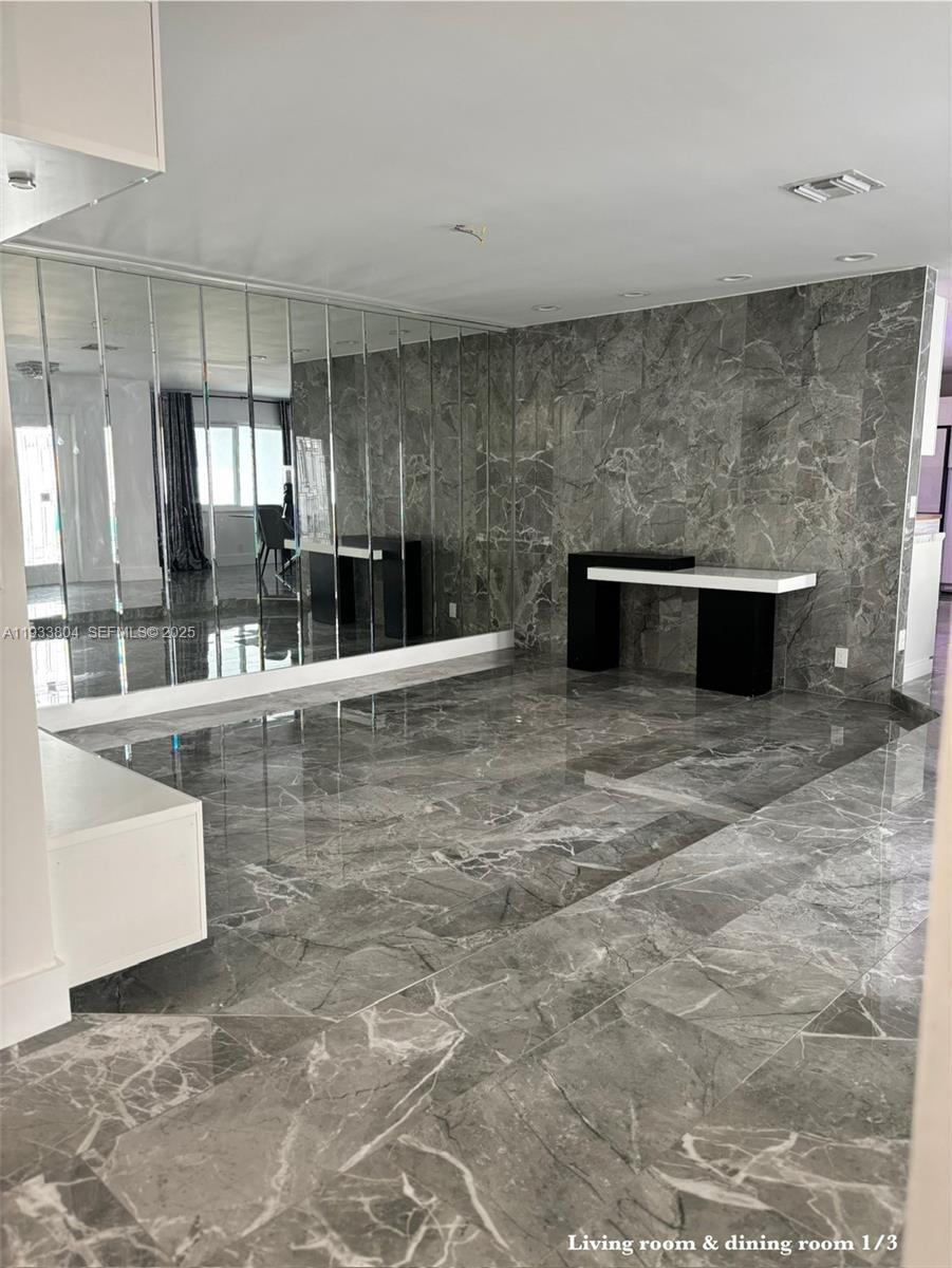 607 Maple Drive Margate, FL 33063 - Photo 3 of 37 a living room with granite countertop furniture and fireplace