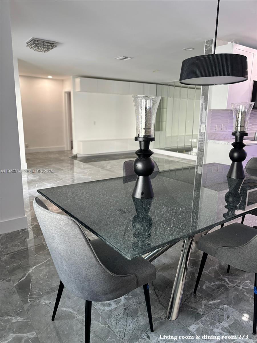 607 Maple Drive Margate, FL 33063 - Photo 4 of 37 a kitchen with a table and chairs