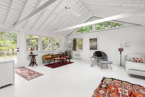 a living room with furniture and a table