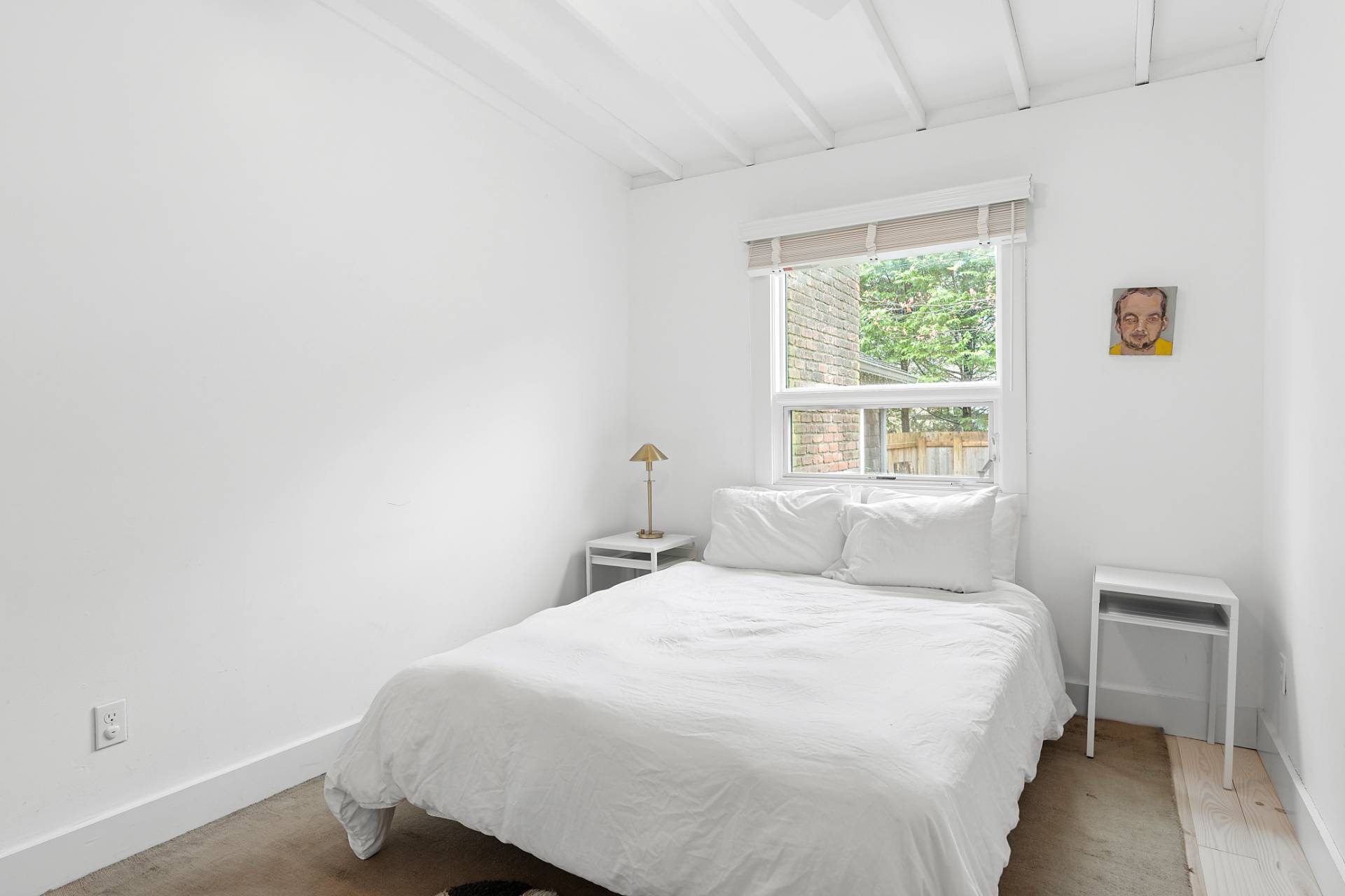 6 Beverly Road East Hampton, NY 11937 - Photo 4 of 12 a bedroom with a bed and a window