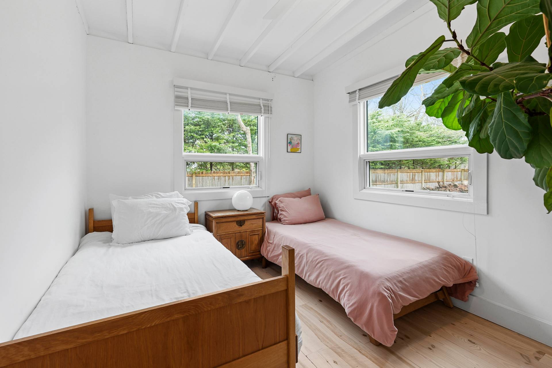 6 Beverly Road East Hampton, NY 11937 - Photo 8 of 12 a bedroom with a bed and a window
