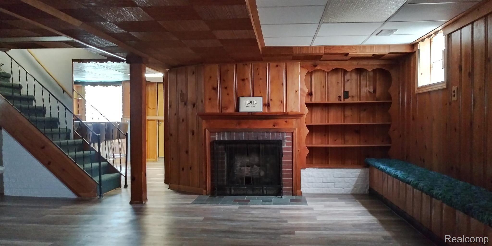 44778 Utica Road Utica, MI 48317 - Photo 25 of 26 Natural gas fireplace sets the stage for this potential mancave.