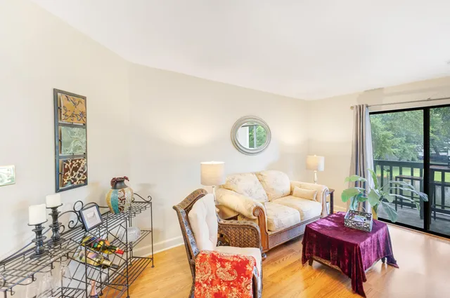 a bedroom with furniture and a large window