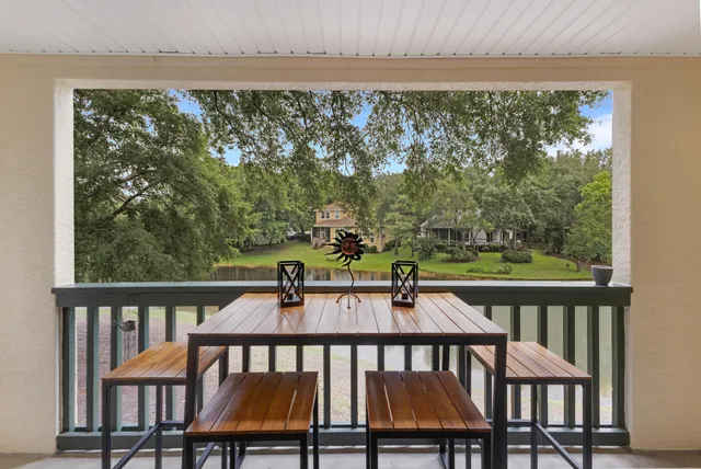 a view of a chairs and table in patio