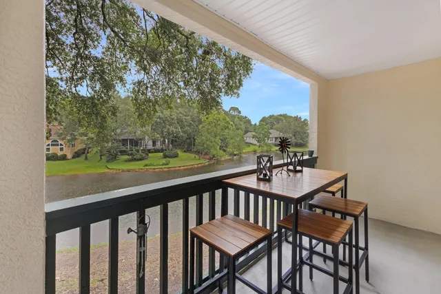 a view of a balcony with furniture