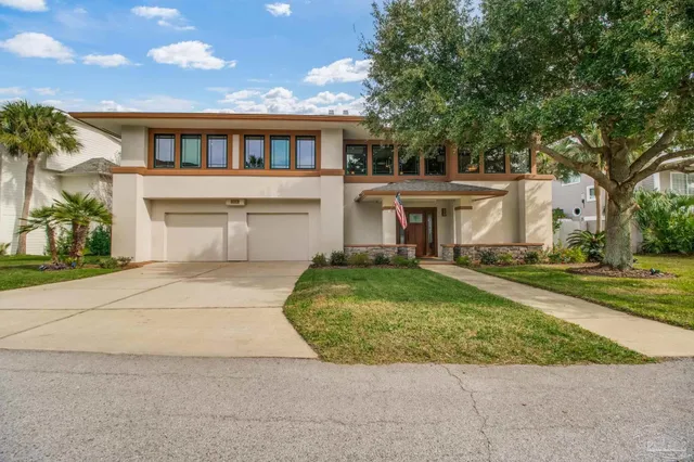 front view of a house with a yard