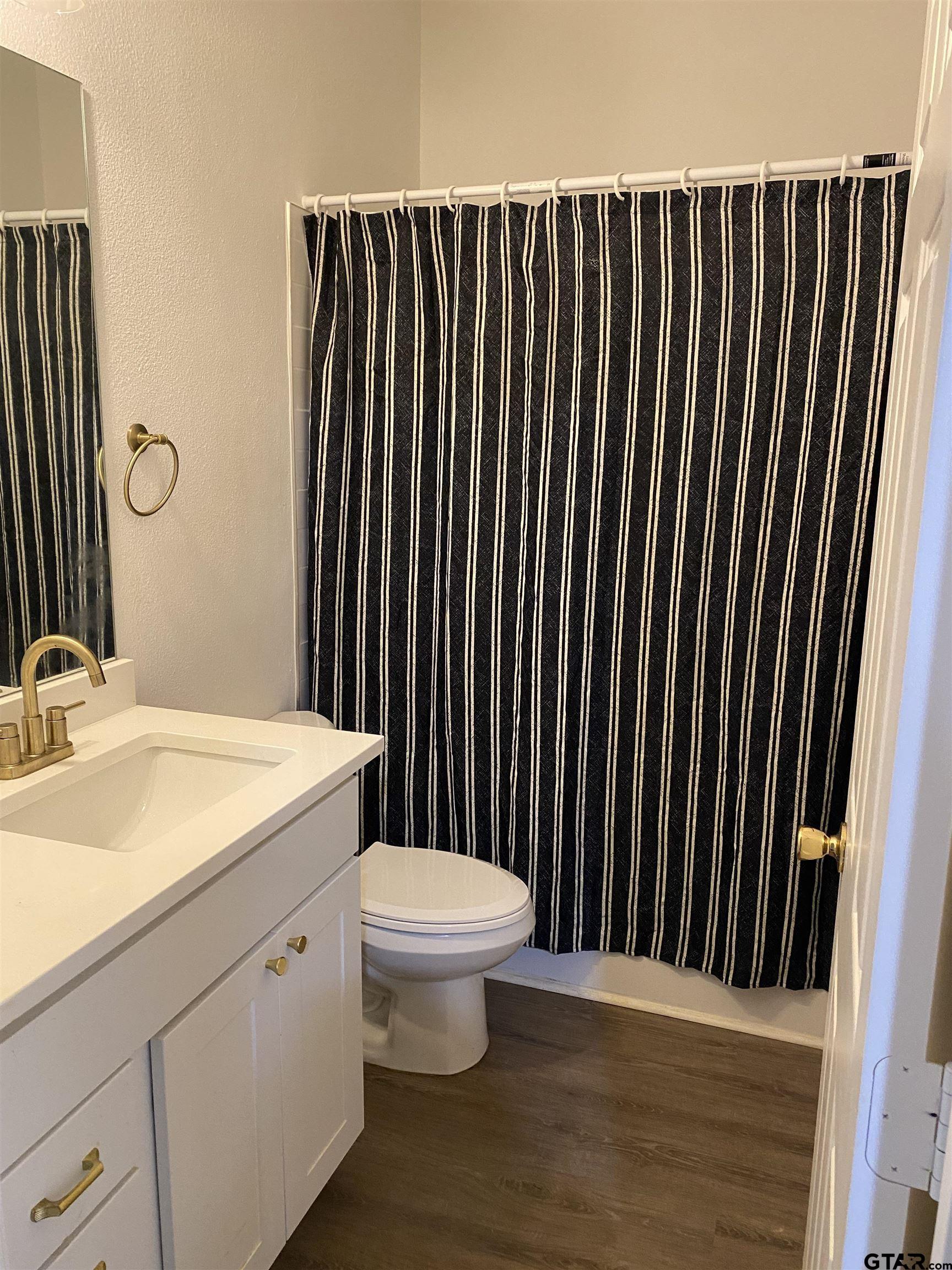 14965 Turtle Crk Rnch Road Flint, TX 75762 - Photo 20 of 22 a bathroom with a sink and a toilet