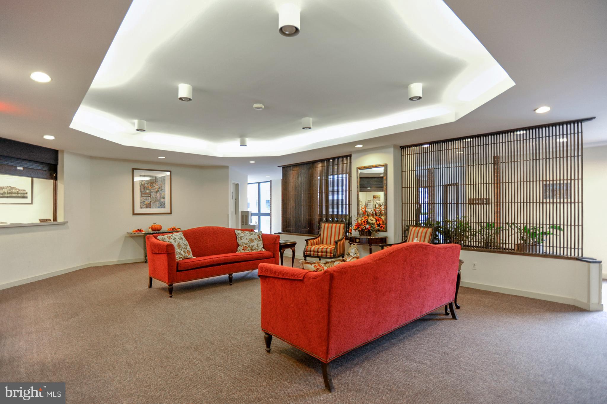 1951 Sagewood Lane, Unit 6 Reston, VA 20191 - Photo 2 of 30 a living room with furniture and a window