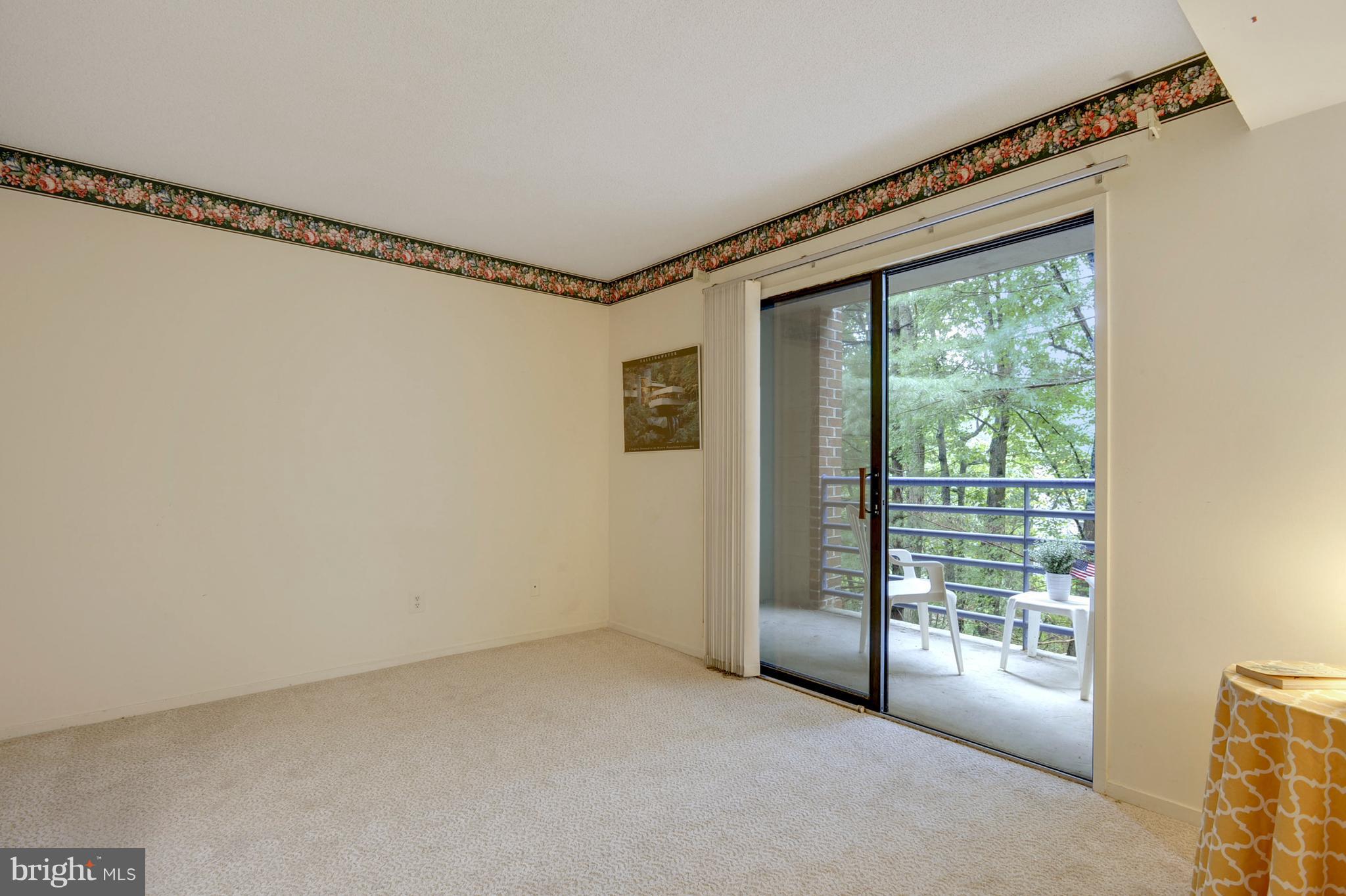 1951 Sagewood Lane, Unit 6 Reston, VA 20191 - Photo 11 of 30 a view of an empty room with a window