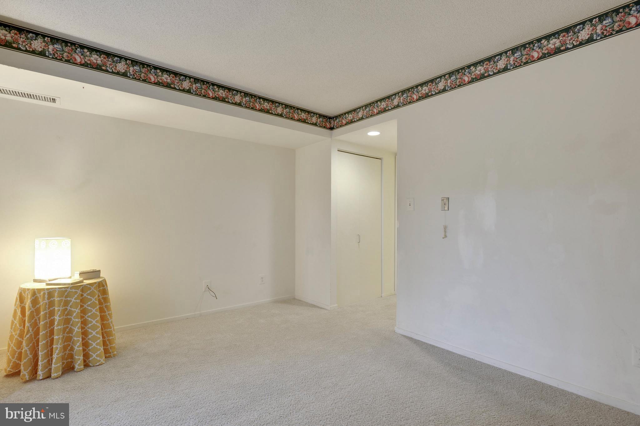 1951 Sagewood Lane, Unit 6 Reston, VA 20191 - Photo 12 of 30 a view of a room with racks on the wall
