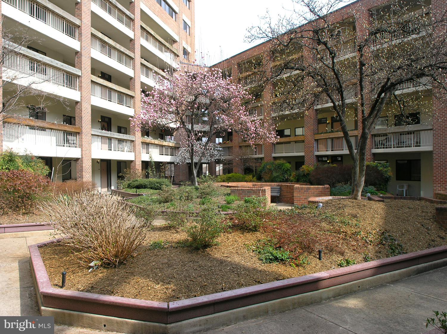 1951 Sagewood Lane, Unit 6 Reston, VA 20191 - Photo 17 of 30 a view of a house with a yard