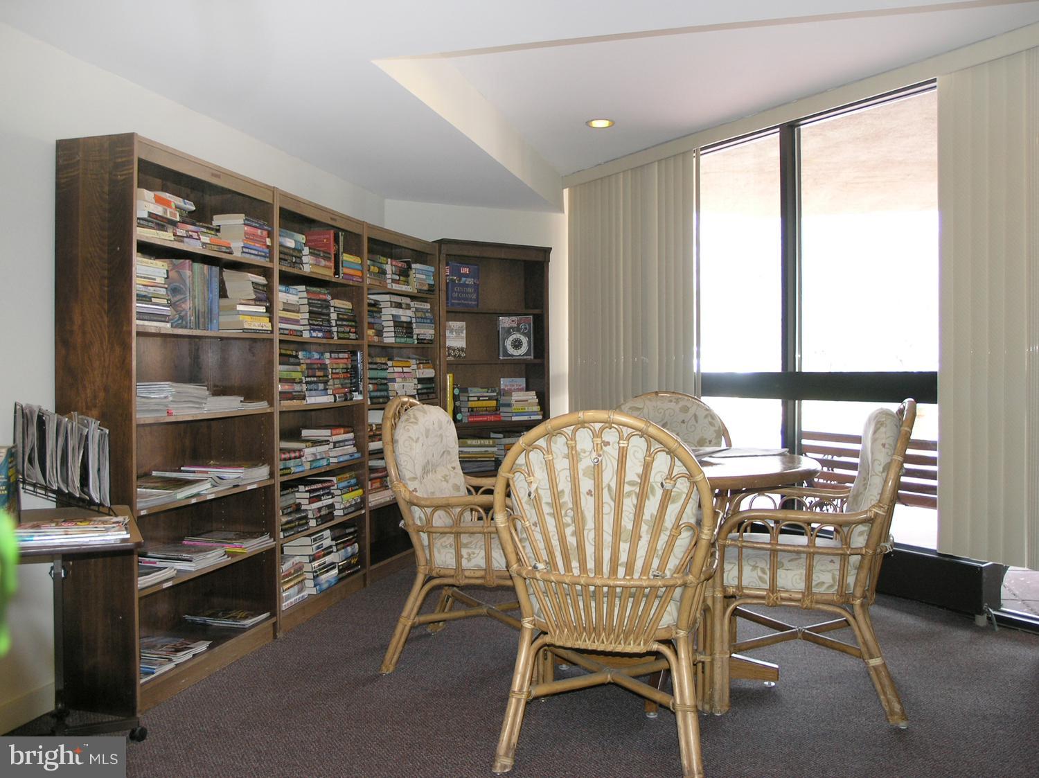 1951 Sagewood Lane, Unit 6 Reston, VA 20191 - Photo 20 of 30 a view of a dining room with furniture and a window