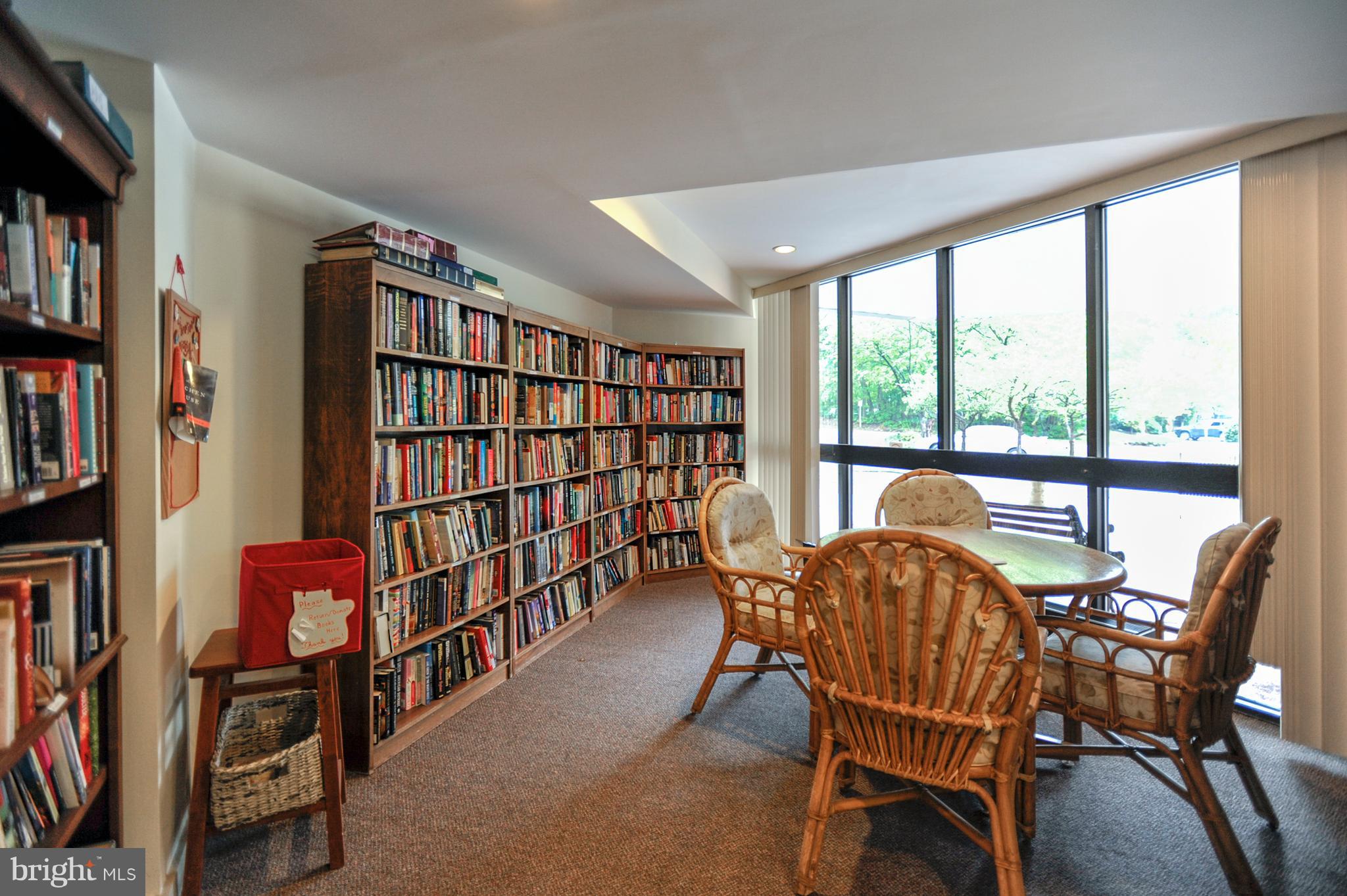 1951 Sagewood Lane, Unit 6 Reston, VA 20191 - Photo 23 of 30 a dining room with furniture fire place and a book shelf