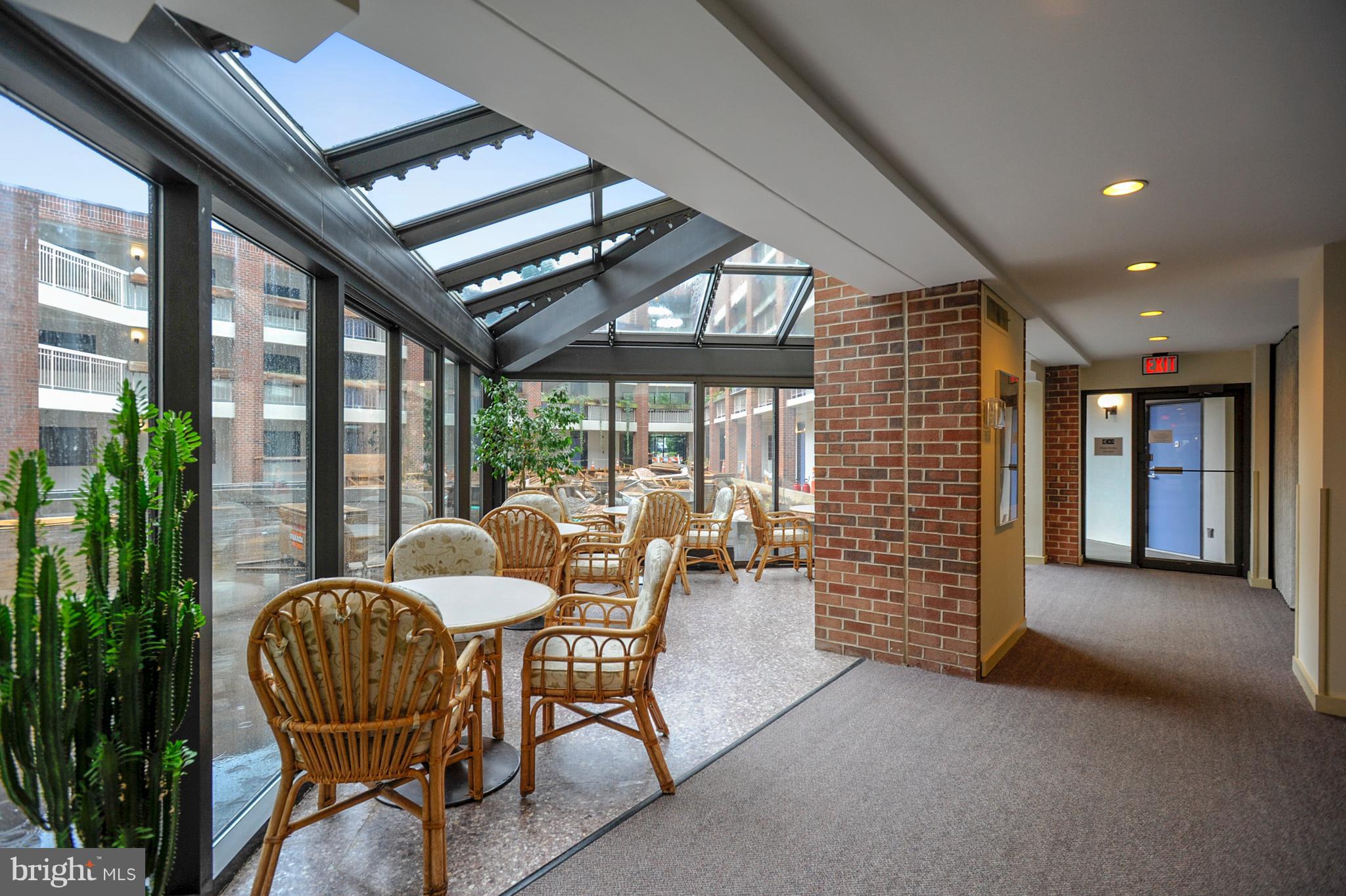 1951 Sagewood Lane, Unit 6 Reston, VA 20191 - Photo 24 of 30 a view of a livingroom with furniture and a large window