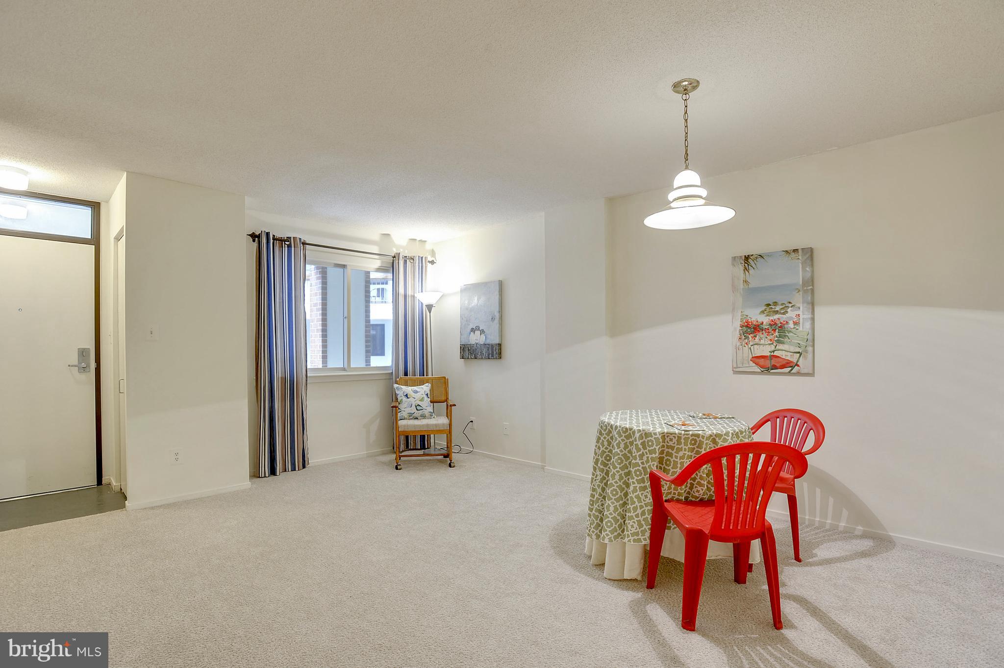 1951 Sagewood Lane, Unit 6 Reston, VA 20191 - Photo 4 of 30 a view of a livingroom with furniture and a chandelier