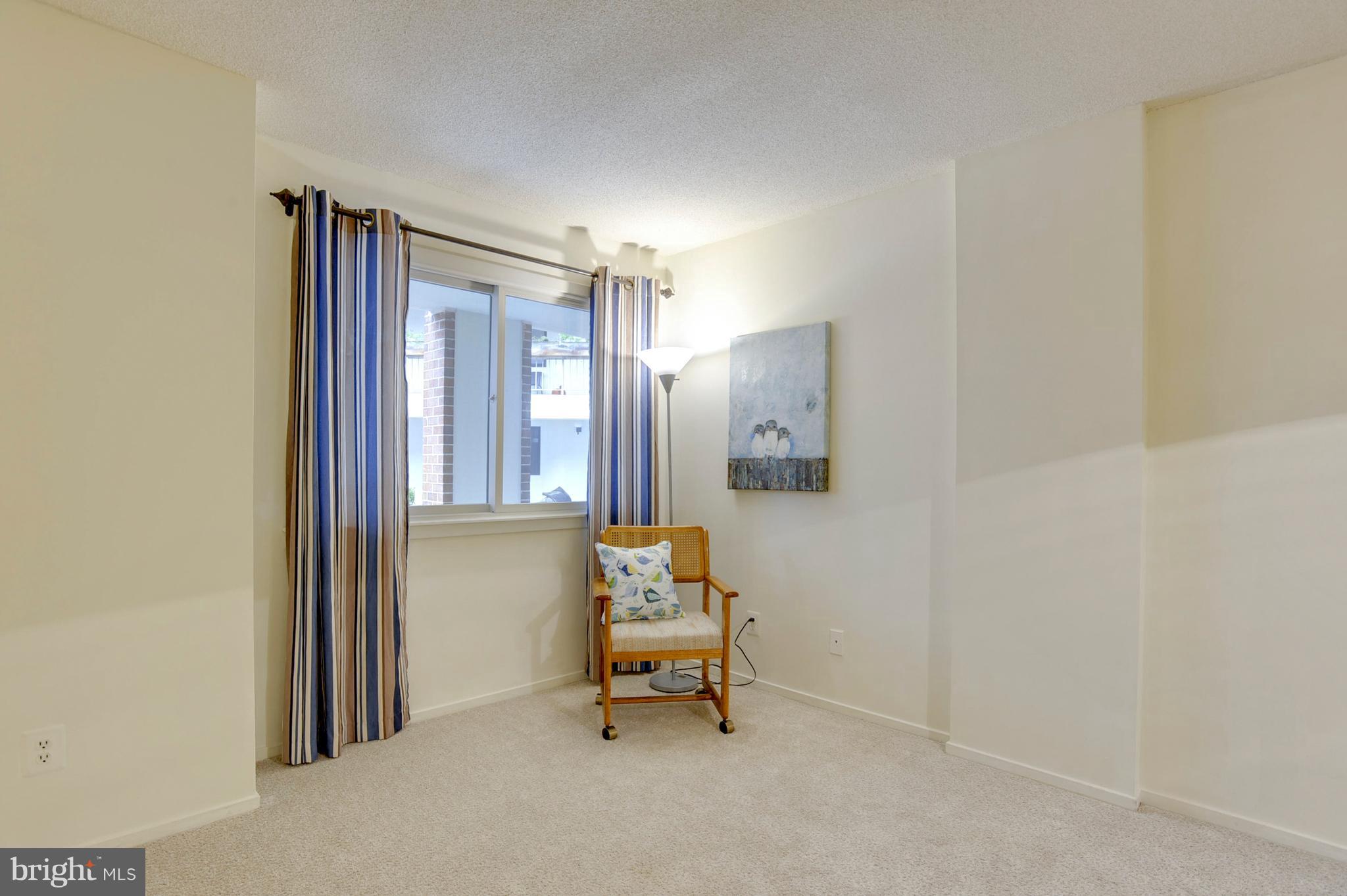 1951 Sagewood Lane, Unit 6 Reston, VA 20191 - Photo 5 of 30 a living room with furniture and a window