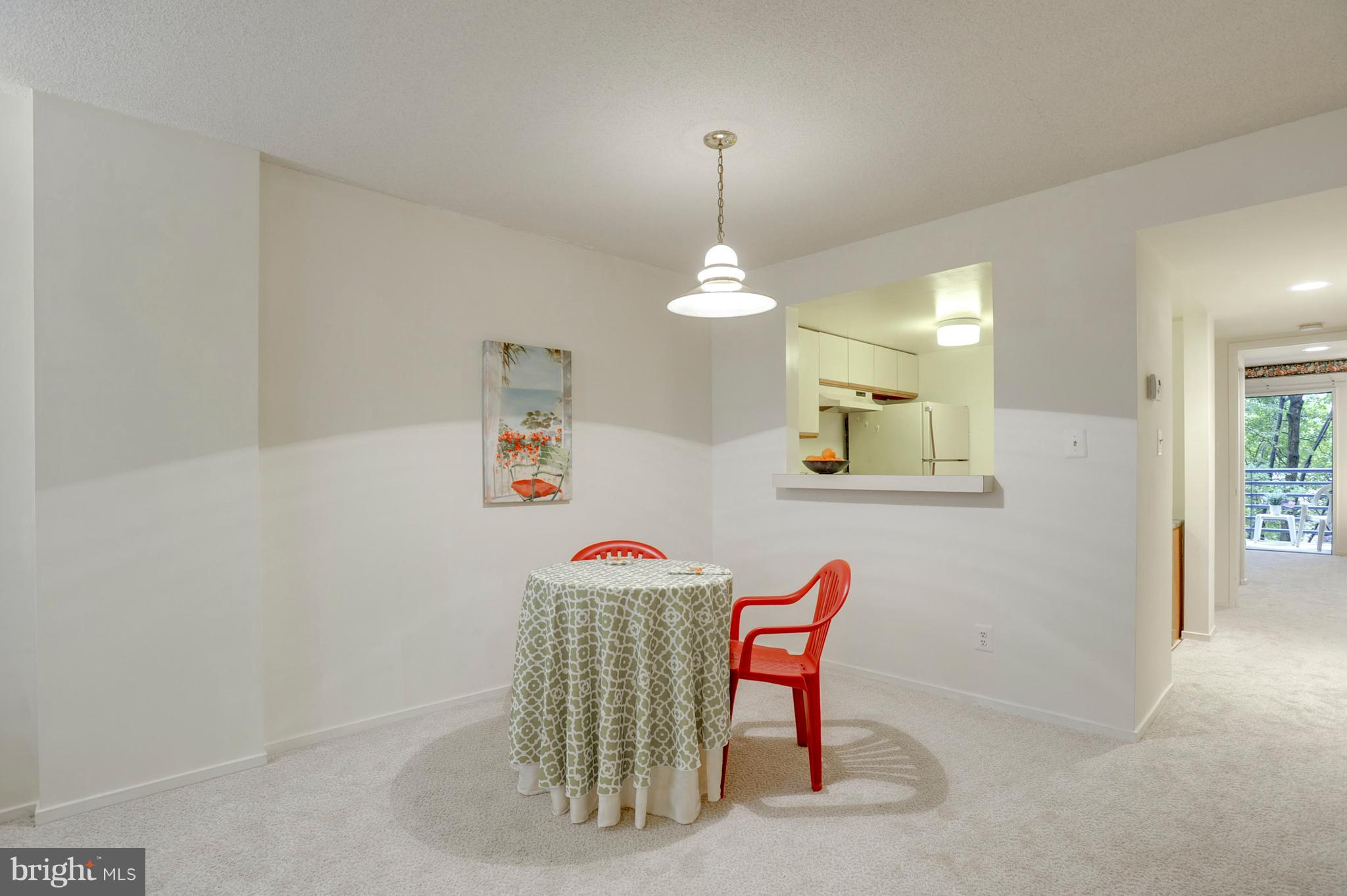 1951 Sagewood Lane, Unit 6 Reston, VA 20191 - Photo 7 of 30 a dining room with a table and chairs