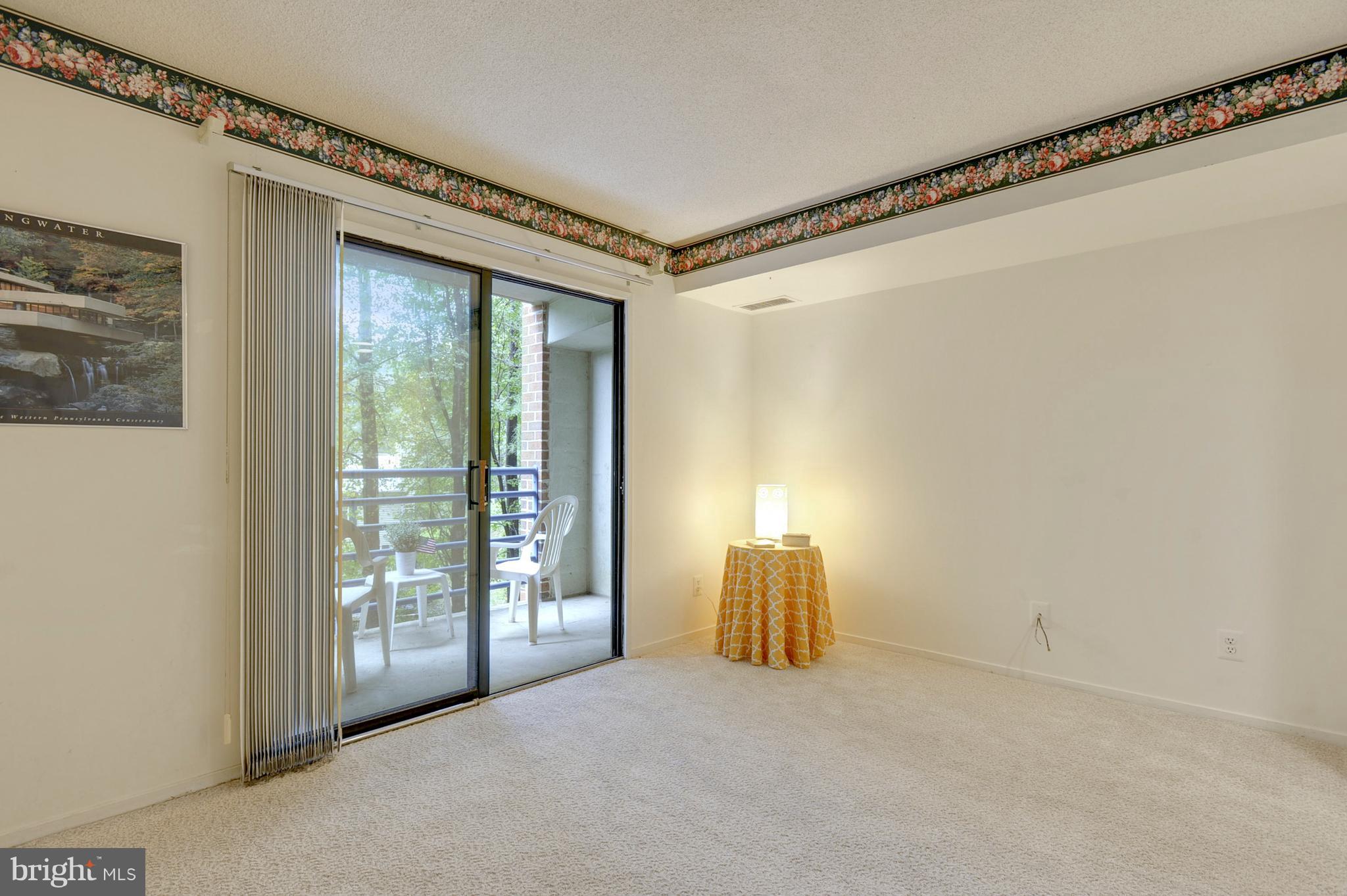 1951 Sagewood Lane, Unit 6 Reston, VA 20191 - Photo 10 of 30 a view of livingroom with furniture and floor to ceiling window