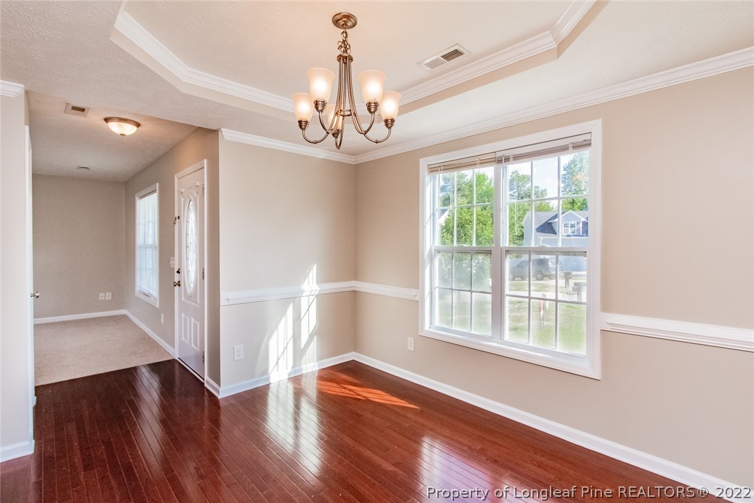 147 Boston Harbor Cameron, NC 28326 - Photo 11 of 27 a view of an empty room with wooden floor and a window