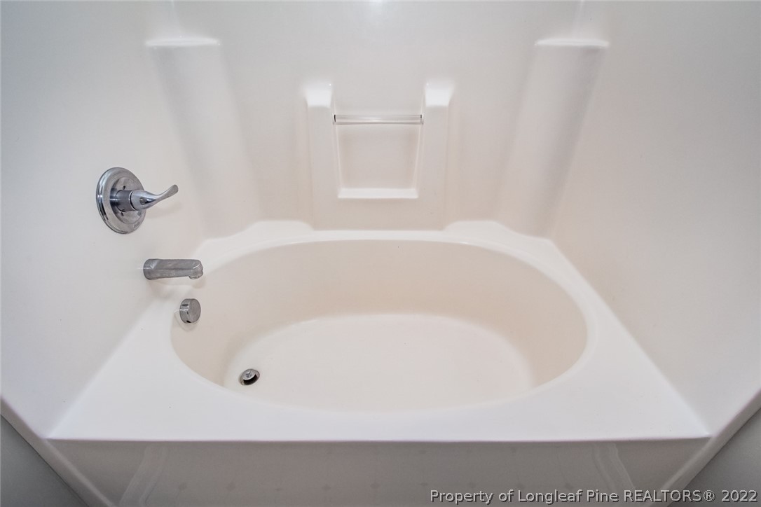 147 Boston Harbor Cameron, NC 28326 - Photo 18 of 27 a white bath tub sitting in a bathroom