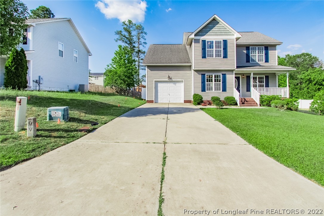 147 Boston Harbor Cameron, NC 28326 - Photo 2 of 27 a front view of a house with a yard