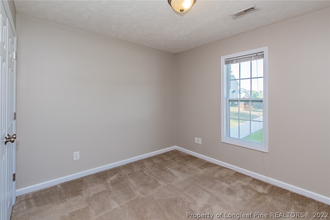 147 Boston Harbor Cameron, NC 28326 - Photo 22 of 27 an empty room with a window
