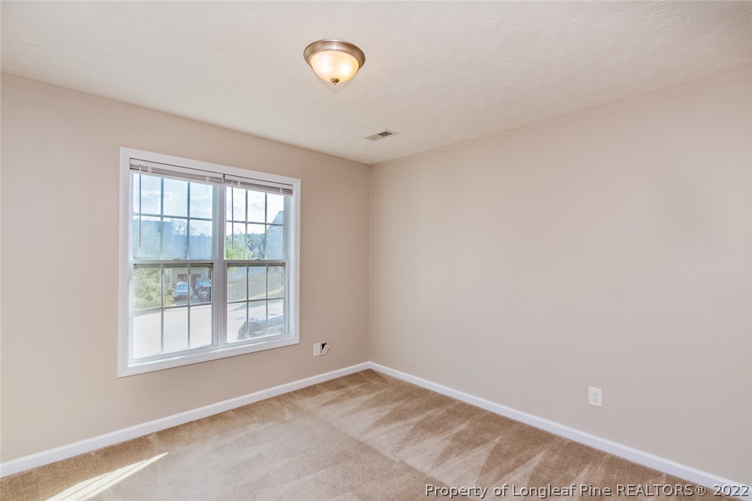 147 Boston Harbor Cameron, NC 28326 - Photo 23 of 27 an empty room with a window