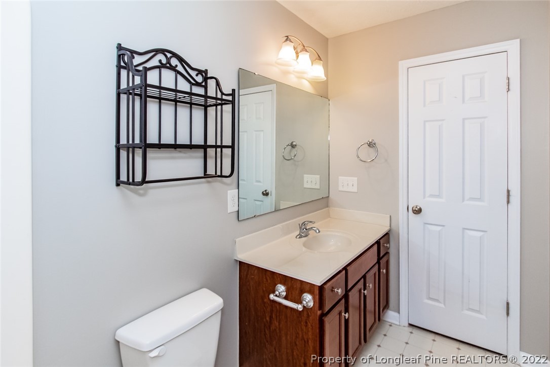 147 Boston Harbor Cameron, NC 28326 - Photo 27 of 27 a bathroom with a sink a toilet and mirror