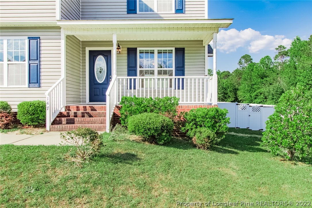 147 Boston Harbor Cameron, NC 28326 - Photo 3 of 27 a front view of a house with garden