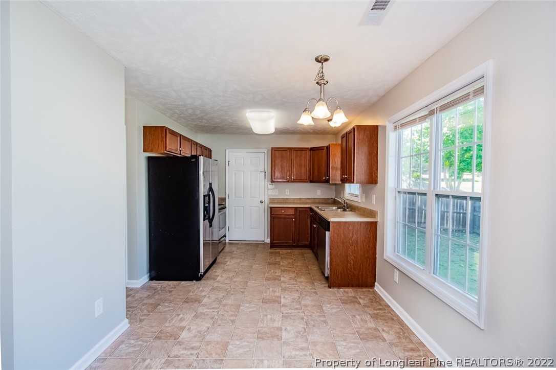147 Boston Harbor Cameron, NC 28326 - Photo 6 of 27 a view of a kitchen with a sink and dishwasher kitchen view